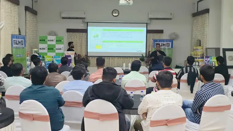 SUMO product presentation at a dealer meet — dealers and contractors watching a live demo