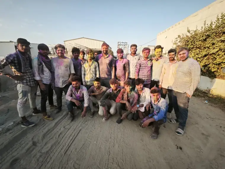 The SUMO team covered in Holi colours outside the plant